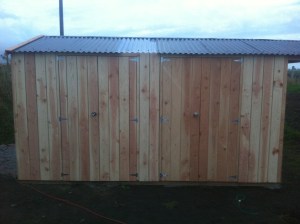 One door for the lawnmower, one door for the quad!