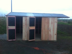 Two sets of double-doors with an overhang to keep the wood dry!